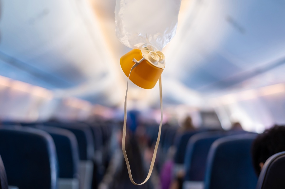 oxygen mask hanging from the ceiling on a plane