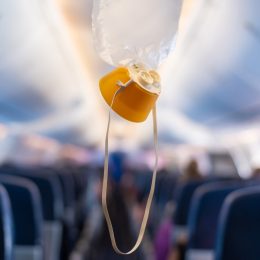 oxygen mask hanging from the ceiling on a plane