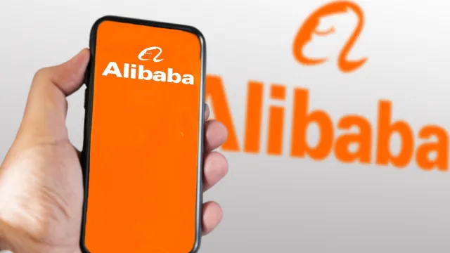 hand holding a phone with Alibaba mobile app on the screen