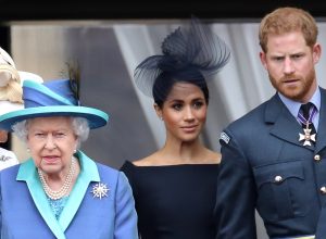 Queen Elizabeth, Meghan Markle, and Prince Harry on the balcony of Buckingham Palace in 2018