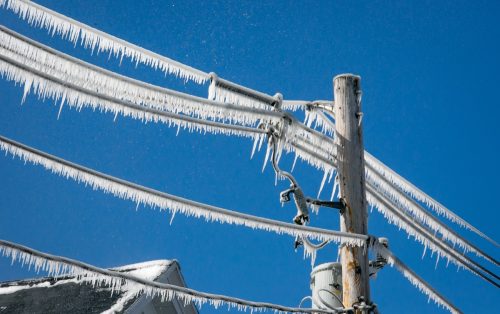 utility pole covered in ice
