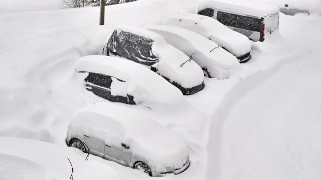 parked cars covered in snow