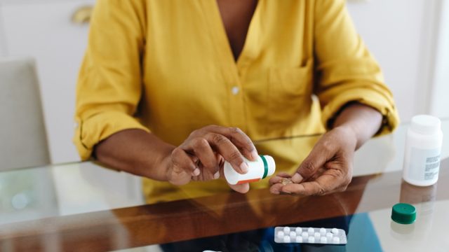 woman taking prescription meds