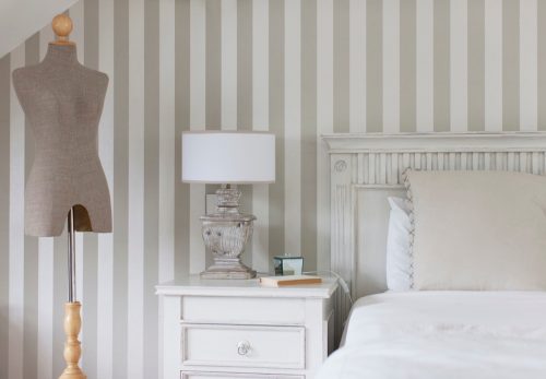 striped wallpaper in a small bedroom
