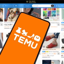Temu logo on a smartphone with a Temu web browser in the background