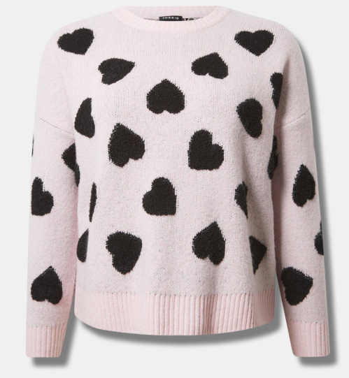 A pink sweater with black hearts from Torrid