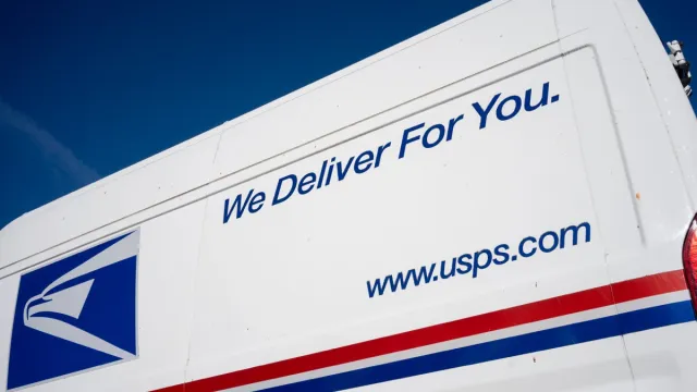 Beaverton, OR, USA - Jan 25, 2022: Closeup of the USPS logo and slogan seen on a United States Postal Service (USPS) van parked on the streets in Beaverton, Oregon.