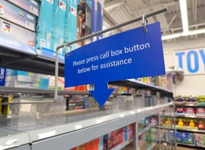 Los Angeles, CA - Dec 17, 2023: Please press call box button below for assistance sign at Walmart store.