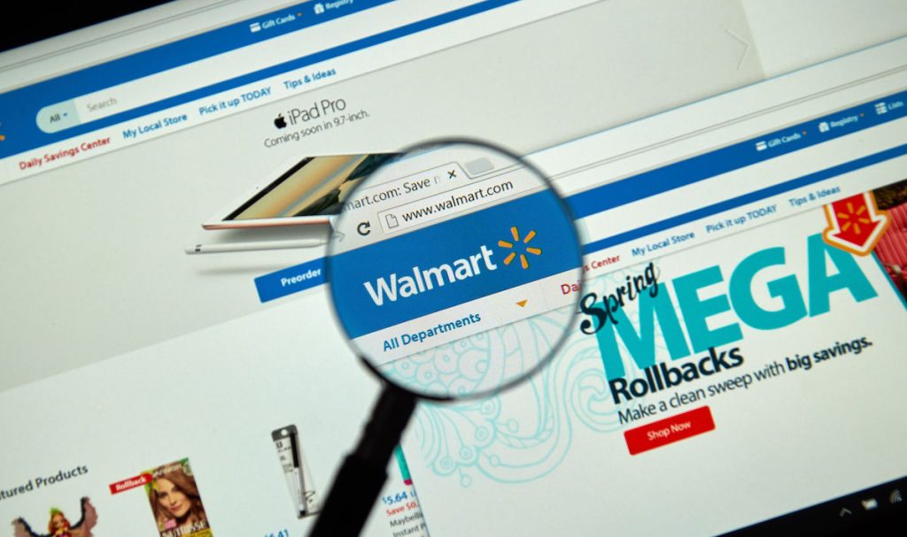 Walmart internet page under magnifying glass.