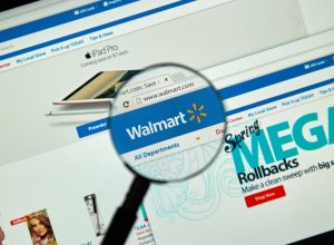 Walmart internet page under magnifying glass.