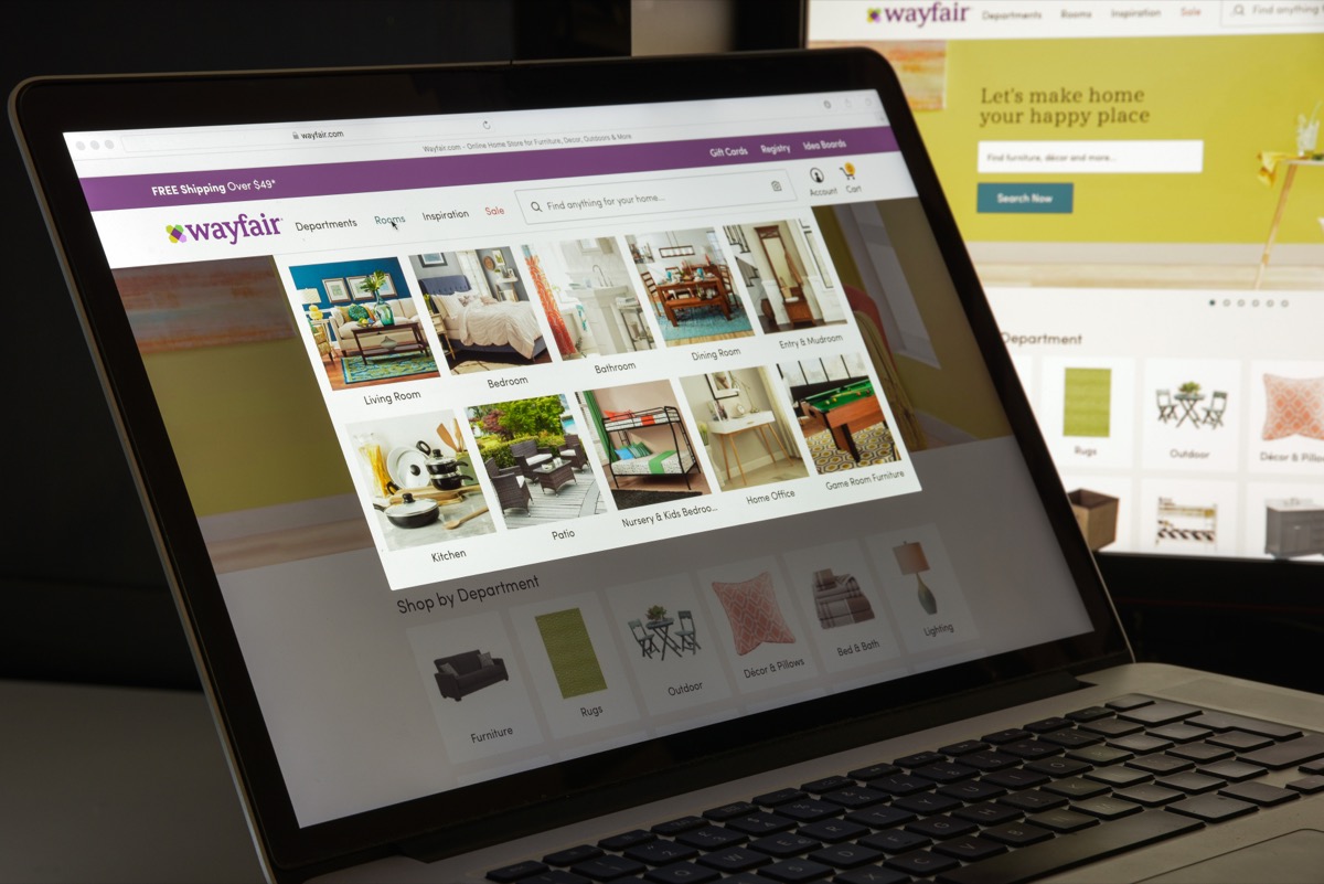 laptop screen showing a person shopping on wayfair