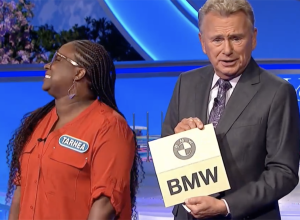 pat sajak holding bmw prize on wheel of fortune