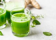 Green detox juice with ginger and mint in glasses and jars. Vegan detox concept.