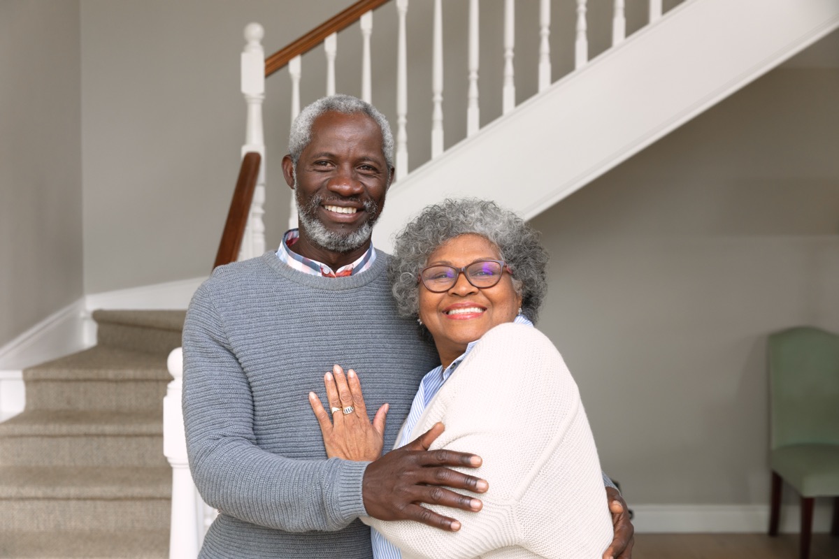 Portrait of a senior African American couple at home, smiling to camera. Family enjoying time at home, lifestyle concept