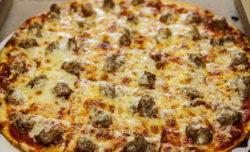Sausage Pizza cut into small squares