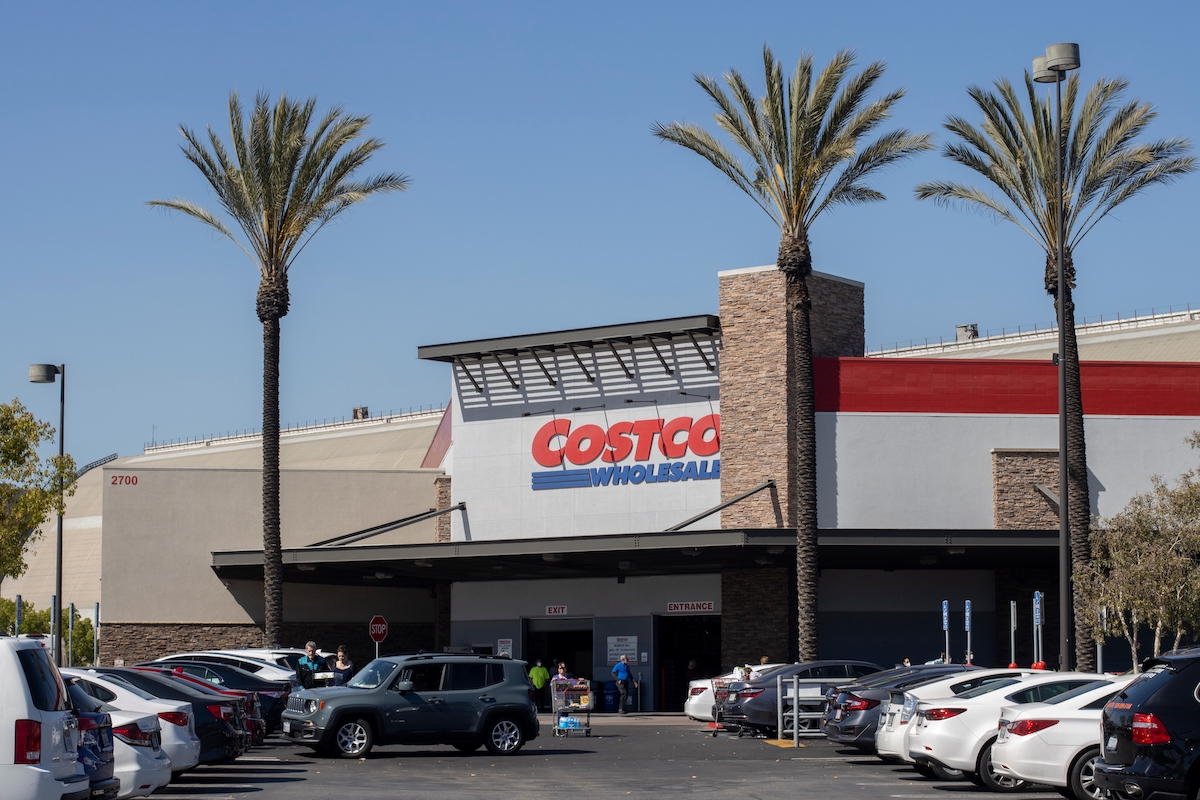 A California Costco with parking lot and palm trees