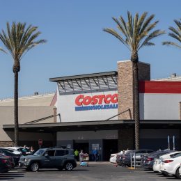 A California Costco with parking lot and palm trees
