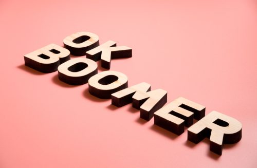 block letters spelling out "OK boomer" over a pink background