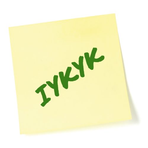 If you know, you know acronym IYKYK written on a post-it-note