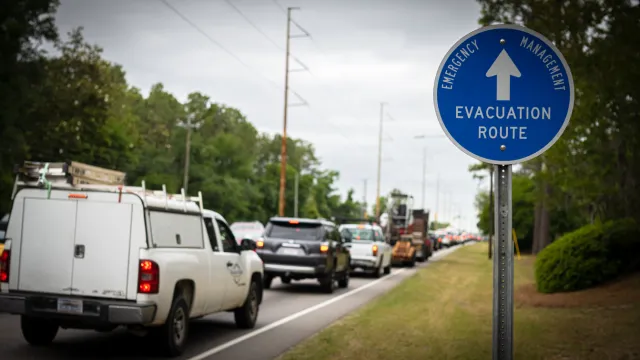 A row of cars leaving town on a hurricane evacuation route