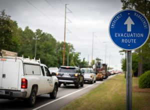 A row of cars leaving town on a hurricane evacuation route