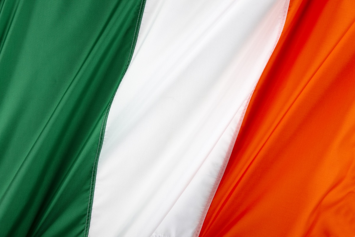 Close up shot of wavy, colorful Irish flag