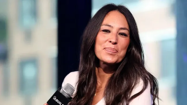Joanna Gaines holding a microphone