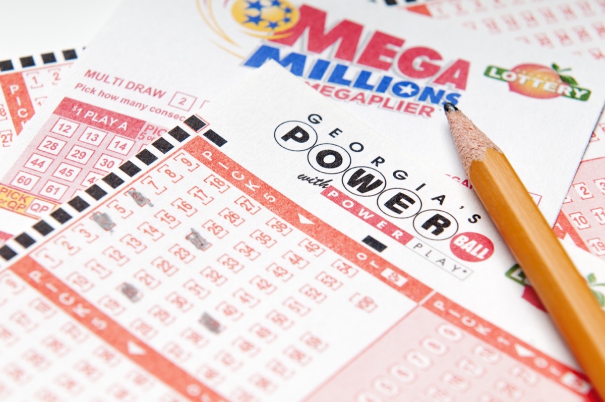 Mega Millions and Power Ball lottery tickets and a pencil