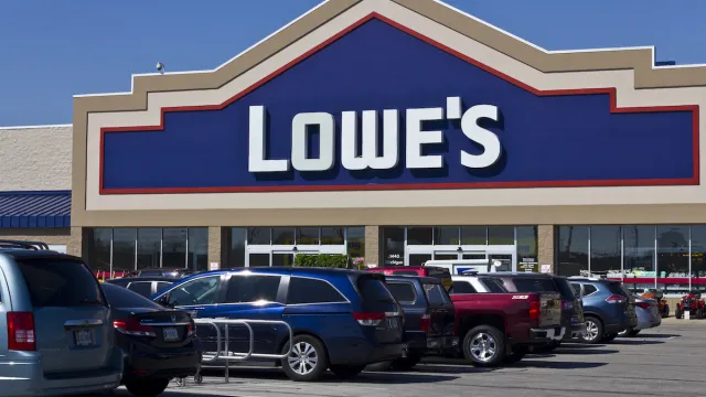 A Lowe's store with cars parked in the parking lot out front