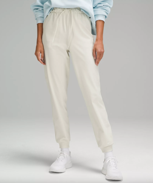 Waist-down image of Lululemon model wearing white joggers
