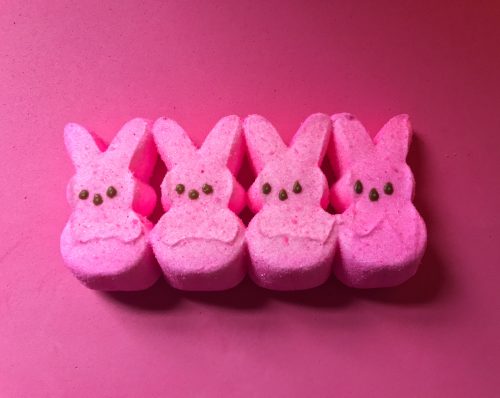 Pink marshmallow Easter peeps candy on pink background