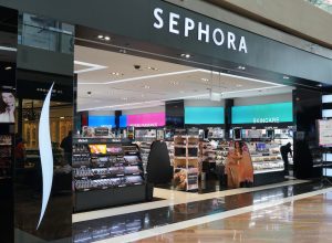 Wide view of the entrance to a Sephora store in a mall.