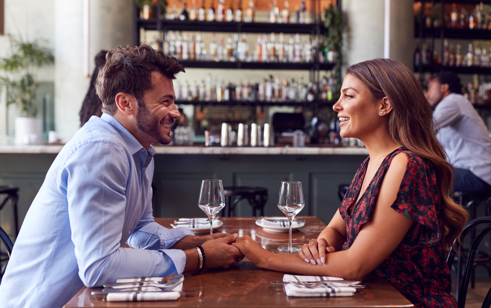 Young couple on romantic first date at restaurant