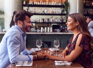 Young couple on romantic first date at restaurant
