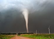 A tornado moving through a field
