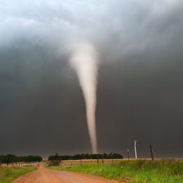 A tornado moving through a field