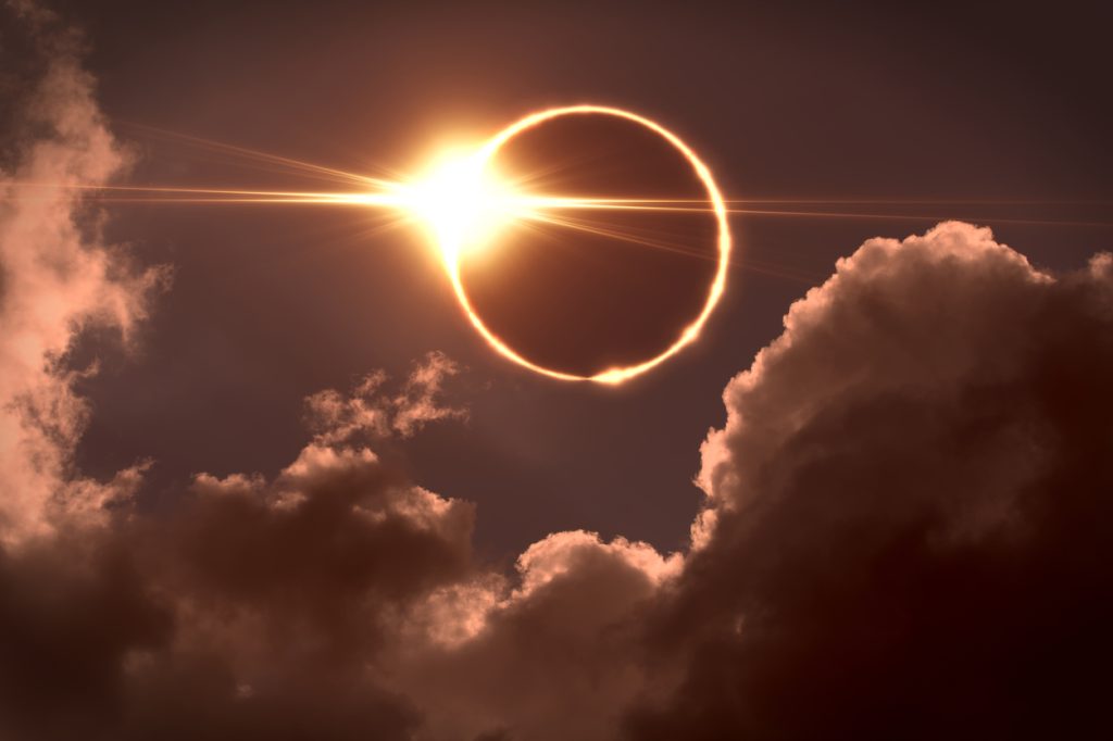 The moon covering the sun during a total solar eclipse with a "diamond ring effect" happening