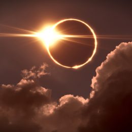 The moon covering the sun during a total solar eclipse with a "diamond ring effect" happening