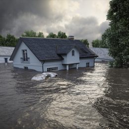 Flooding houses with rising water.