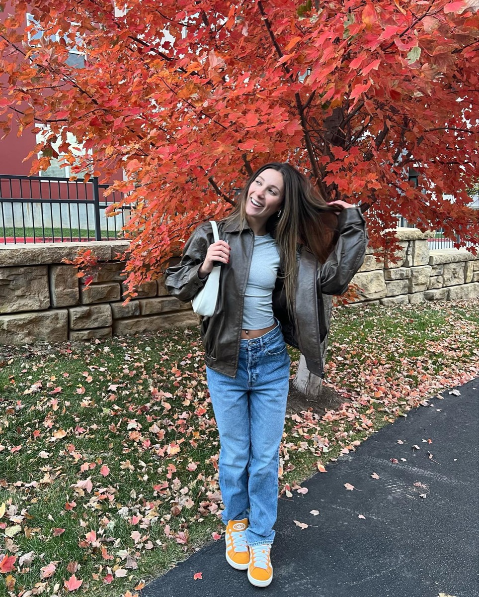 Jenna Barber posing in front of a tree