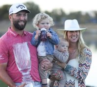 Jon Rahm, Kelley Cahill, and their two children in 2023