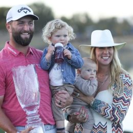 Jon Rahm, Kelley Cahill, and their two children in 2023