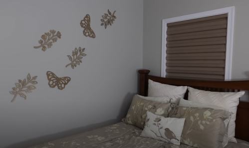 Wooden cutouts shown on a bedroom wall
