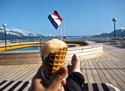 Man holding ice cream on cruise ship deck