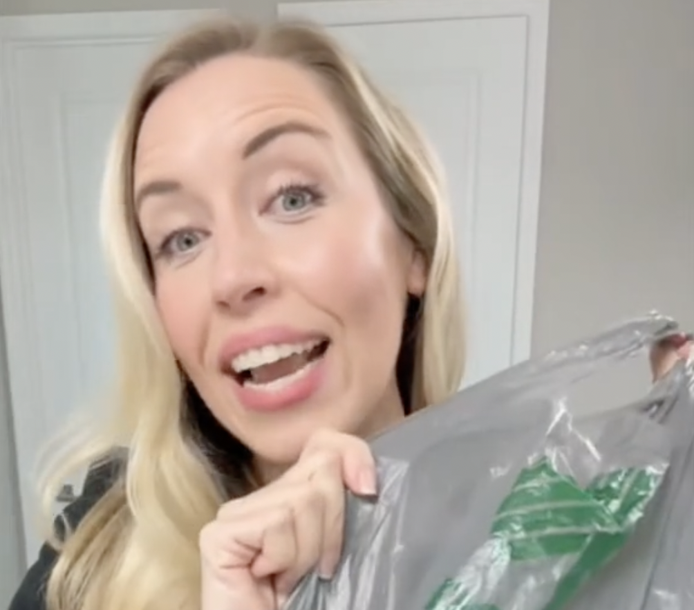 Dermatologist Maren Locke holds up a skincare product from Dollar Tree