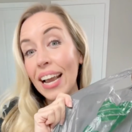 Dermatologist Maren Locke holds up a skincare product from Dollar Tree