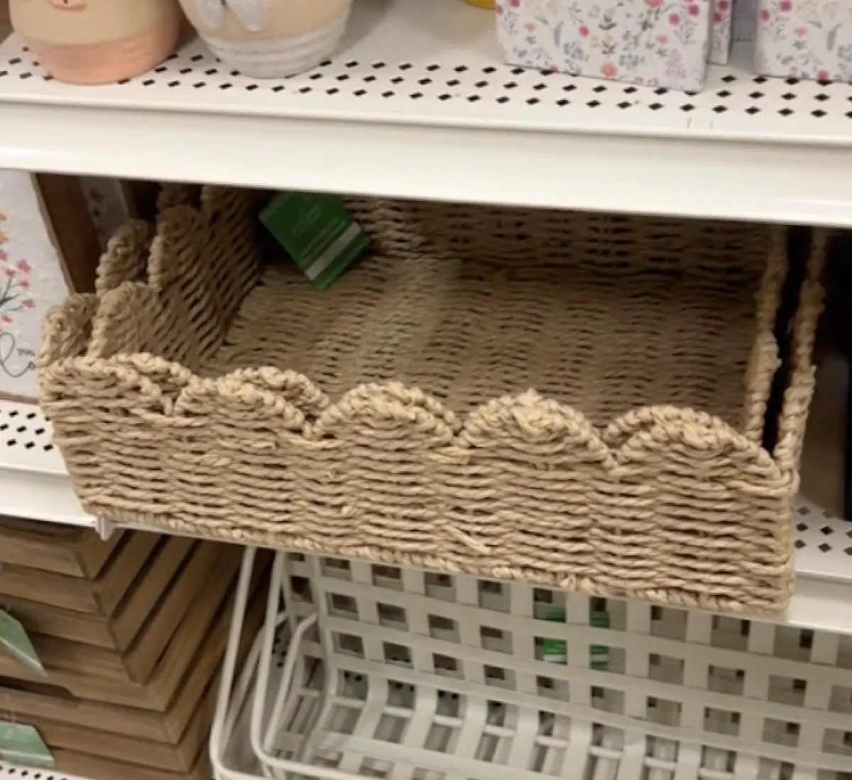 Scalloped rattan tray from Michaels on shelf