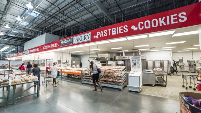Bakery aisle in Costco store. It is largest wholesale membership-only warehouse club and second largest retailer in US, known for its low-price offers. Customer shopping