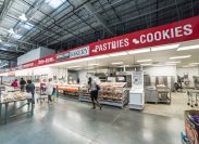 Bakery aisle in Costco store. It is largest wholesale membership-only warehouse club and second largest retailer in US, known for its low-price offers. Customer shopping