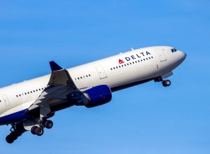 A close up of a Delta Air Lines Airbus A330 taking off.